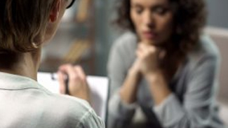 A health professional talking to a woman