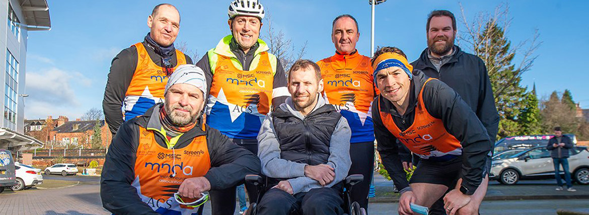 Image of Rob, Kevin and Friends wearing MNDA branded clothing