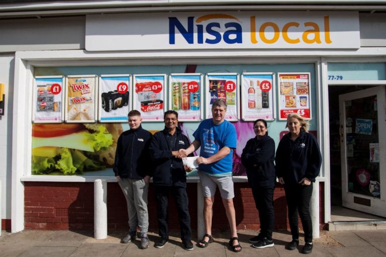 a photo of a group of people outside of a convenience store