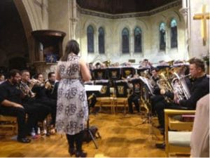 a group of people playing instruments in a church