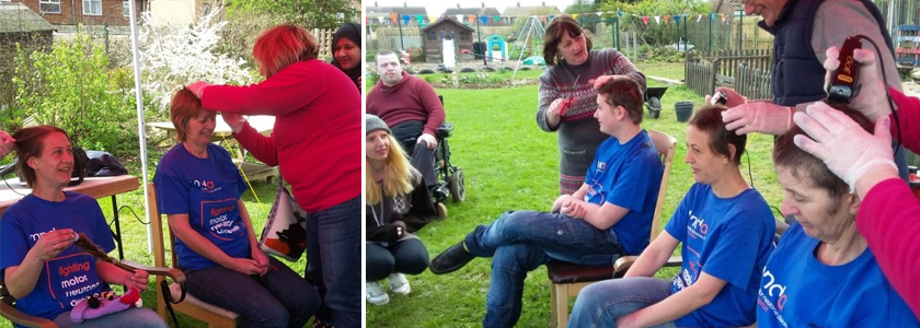 a group of people wearing mnd association t-shirts getting a haircut