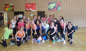 a group of a ladies zumba group
