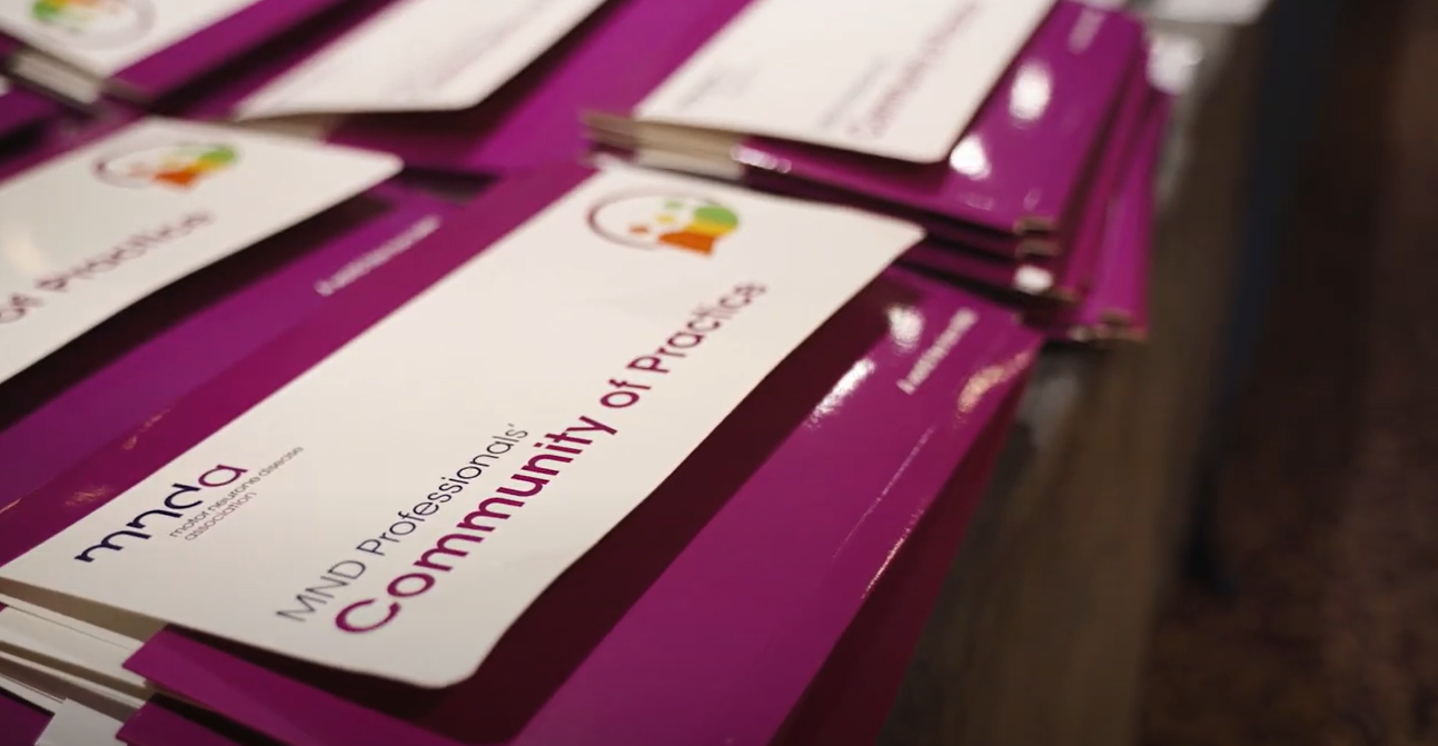 purple folder with logo and name of the community of practice