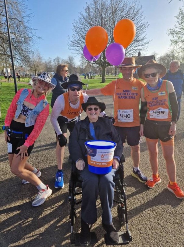 MND association fundraisers with balloons and large collection bucket 