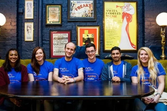 Group of volunteers sat at a table.