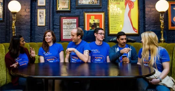 Group of volunteers talking around a table
