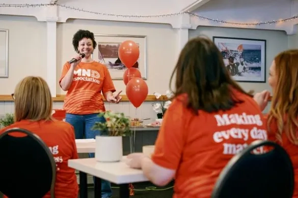 A group of people campaigning in a classroom